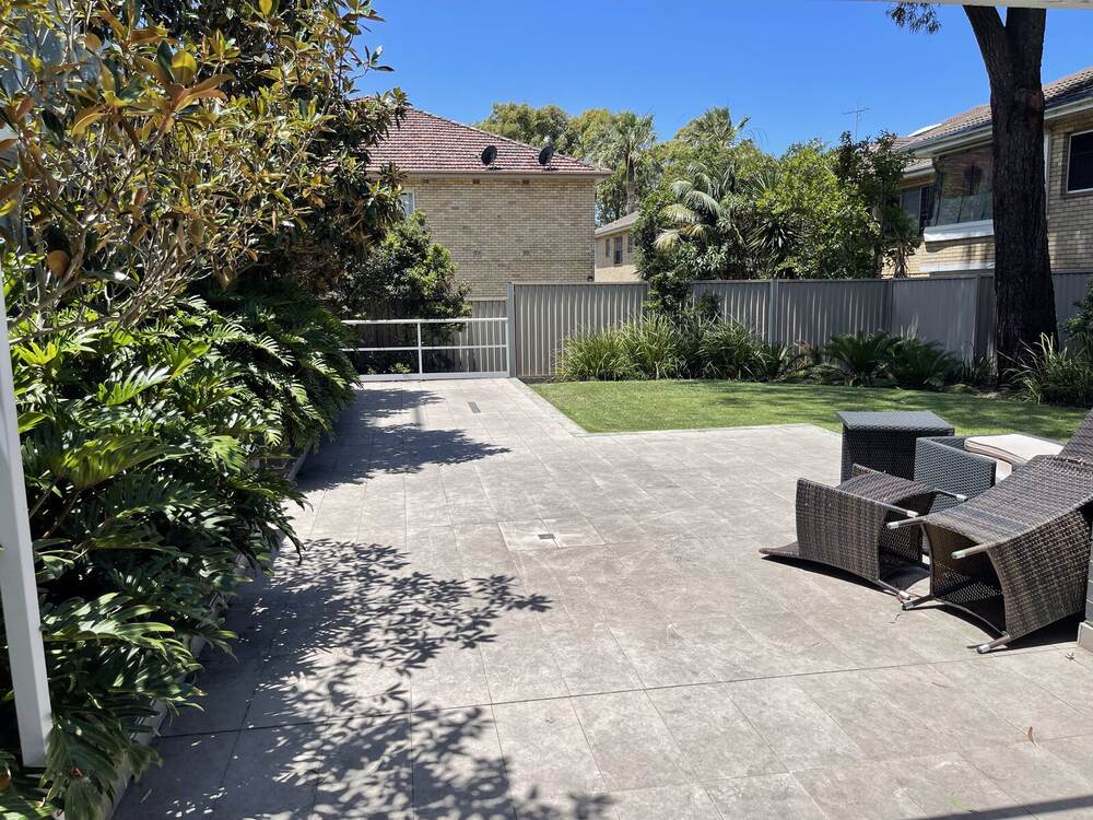 A tidy garden bed and patio maintained by Eaton Gardening on Sydney's North Shore